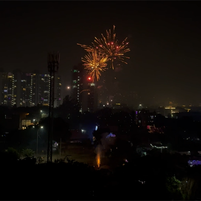 fire-crackers-in-the-city-sky-new-year-christmas-diwali-indian-stock-footage