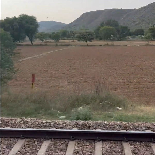 mountain-view-from-rail-window-with-railway-track-indian-railway-stock-footage