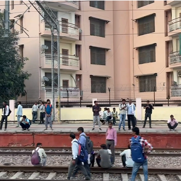 public-crowd-standing-on-the-railway-station-jagat-pura-indian-railway-stock-footage