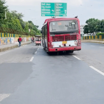 dtc-bus-running-on-the-road-indian-stock-footage