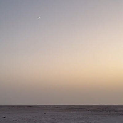 moon-over-the-white-sand-ground-in-dholavira-gujarat-stock-footage-watermarked